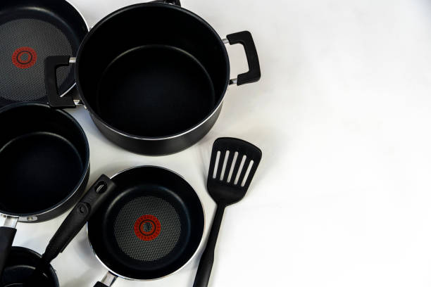 istock cookware set, steel dinner set isolated on white background, black metal cookware set 1436718134
