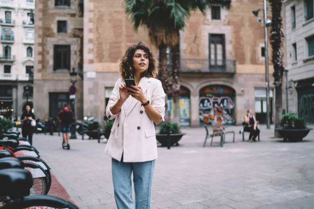 istock Stylish young woman on old town square 1436718339