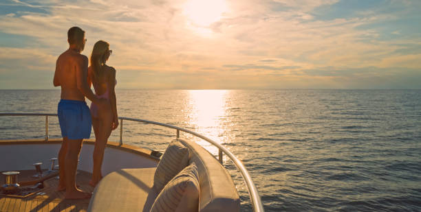 istock Couple standing on yacht 1436720067