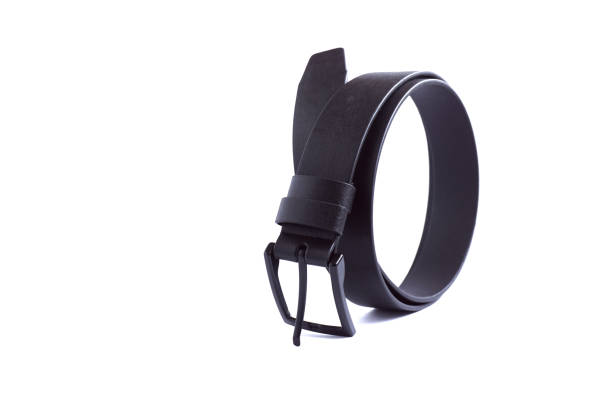 Curved new black leather belt on a white background.