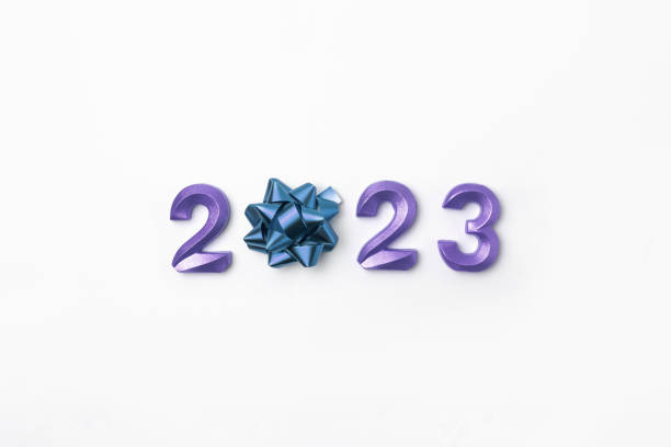 istock 2023 Violet Numbers on White Table. Modern New Year Background. Creative Greeting Card. Flat Lay, Top View, Copy Space. Banner Design. Minimal Festive Mock Up with Numbers. Time to Celebrate Holiday 1436722090