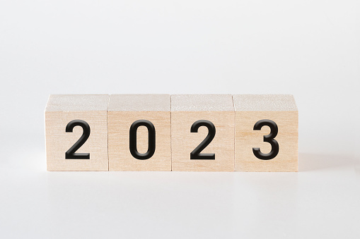 Cubes on white background forming the word “2023