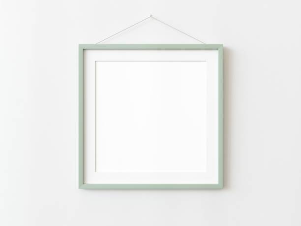 istock Green wooden squared frame hanging on a white textured wall mockup, Flat lay, top view, 3D illustration 1436723418