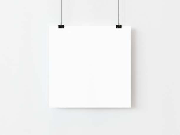 istock One blank square poster template hanging on thread with paper clips on white background. 3D illustration 1436723466