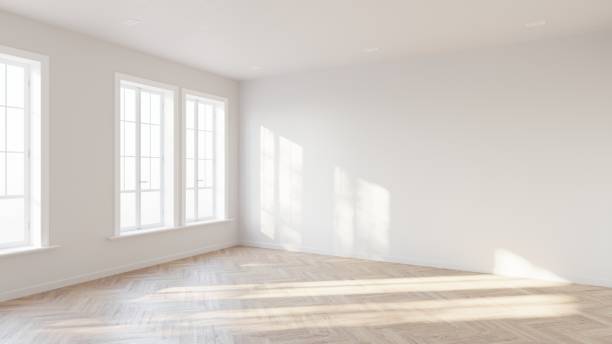 istock Abstract of empty white room with sun light cast the three vertical tall window shadow on the wall and wood laminate floor, Perspective of minimal interior design architecture. 3D illustration 1436723500