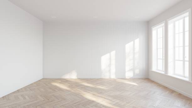 istock Abstract of empty white room with sun light cast the two vertical tall window diagonal shadow on the wall and wood laminate floor, Perspective of minimal interior design architecture. 3D illustration 1436723514