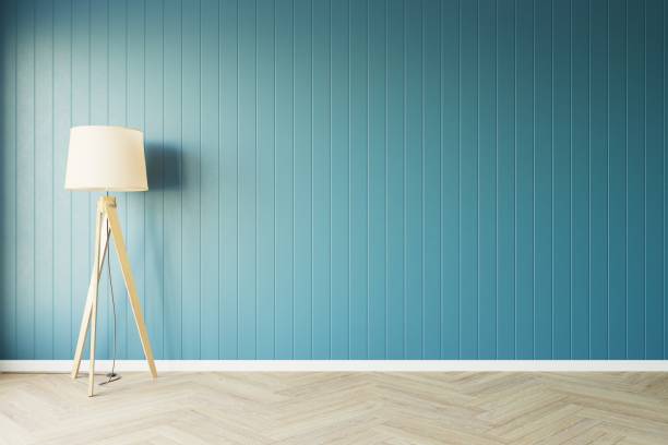 istock Classic style empty blue room with wood laminate floor window sun light effect with lamp against the wall on the left, Perspective of  home interior illumination, 3D illustration 1436723549