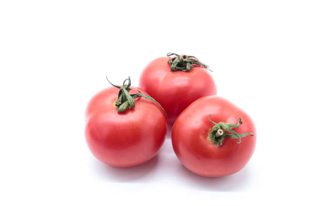 istock tomatoes isolated on white background. healthy food concept 1436724092