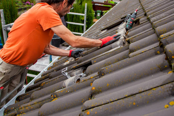 istock Roofer, worker on the rooftop. Roofing work. Solar Cell Installation. Preparation of Solar panel installation. attaching rails, hooks. scaffolding on construction site 1436724891