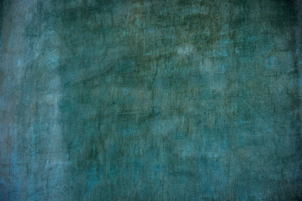 istock Old turquoise paint on the wall. Old blue wall stucco background 1436726785