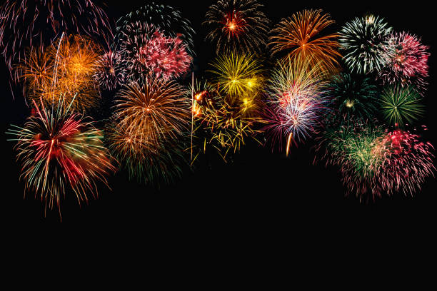 istock Fireworks of various color bursting against on  black background . 1436726825