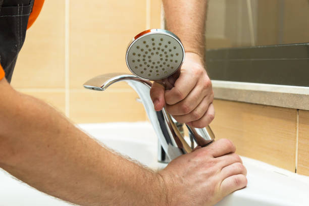 istock The master repairs a broken faucet in the bathroom, close-up 1436727773