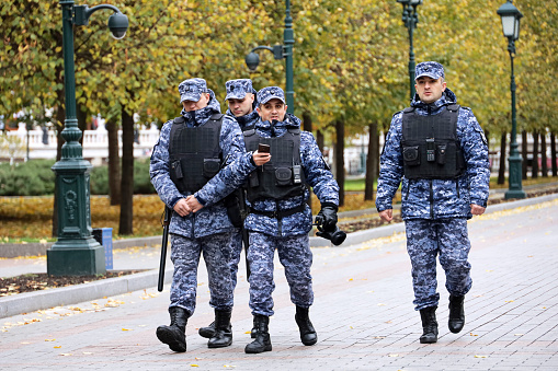 Moscow, Russia - October 2022: Soldiers of russian military forces in bulletproof vests walking in Alexander garden
