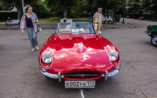 Moscow, Russia - July 31, 2022: Red classic muscle car 1967 Jaguar E Type Series 4.2  presented at the Moscow Capital Historic Car Rally 2022.