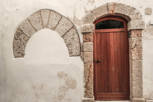 Wooden door entry in Italy.