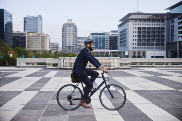 istock Young businessman leaving work for the day on his bicycle 1436730821