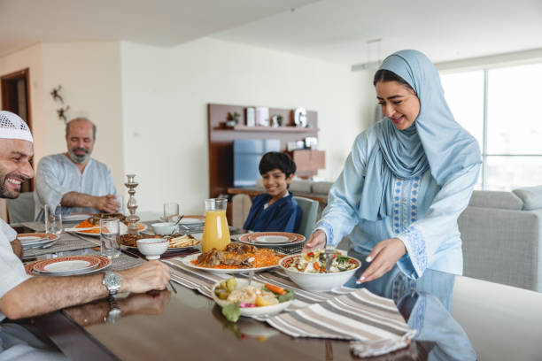 istock Middle Eastern Mother Is Placing Everything On Dining Table For Family Lunch 1436732087