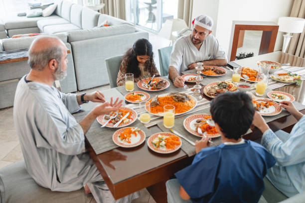istock Middle Eastern Grandfather Talking To Father While Having Family Lunch 1436732136