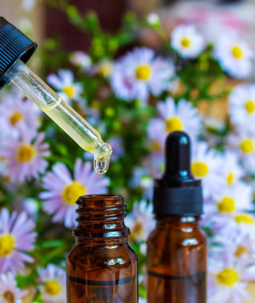 istock flower oil in glass bottles.homeopathy.selective focus 1436732501