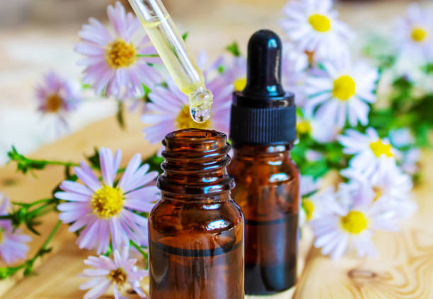 istock flower oil in glass bottles.homeopathy.selective focus 1436732537