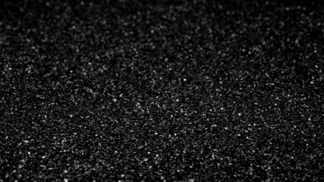 Black sand background.