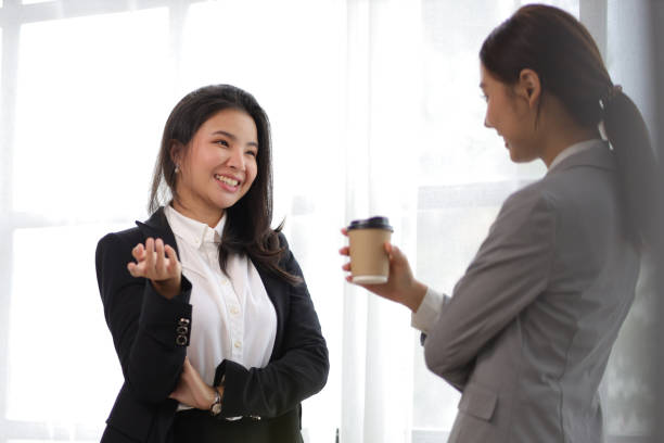 istock Colleagues, businesswomen or partners discussing, exchanging ideas, discussing successful business projects. 1436737369