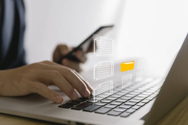 istock business people use laptop to manage electronic documents The concept of efficient access to an online corporate business document database. Internet file system Digital technology paperless office 1436738060