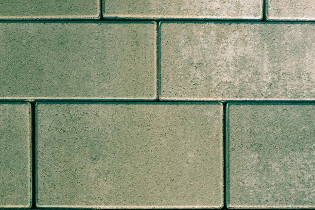 istock Vibro-pressed concrete paving slabs. Pattern of rectangles, bricks. Texture of road tiles 1436739466