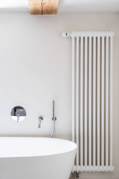 istock Central heating in bathroom near white modern tub 1436740935