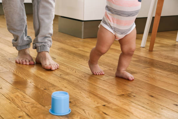 istock Father teaching his boy to walk 1436741162