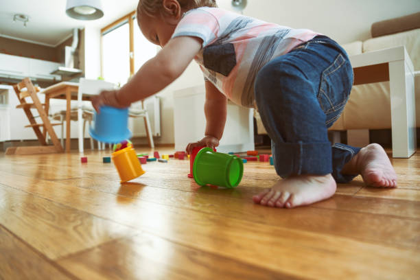 istock Little boy playing with his toys on the floor 1436741217