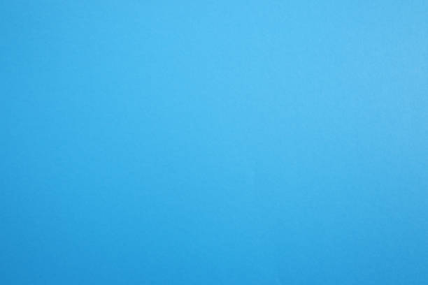 istock Paper, cardboard background. High resolution paper texture. Colored Blue background. 1436741407