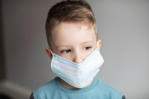 istock Boy wear mask for protection flu virus. Quarantine. 1436741938