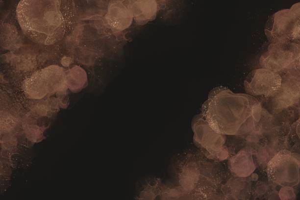 istock Alcohol ink art on black background.　Glitter on orange waves. Text space. Night and party concept. Haze and gold dust on dark background 1436745884