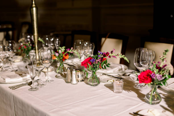 istock Head table at a wedding reception with florals in glass vases 1436746147