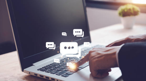 istock Live chat and notification with businesman typing notebook (Laptop) with social media icon. Social media and digital online concept. 1436748263