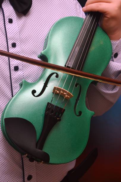 istock violin in the hands of a child 1436749992