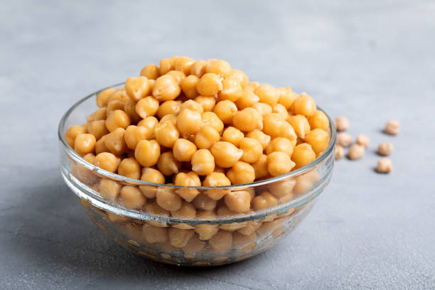 istock Boiled chickpeas in a glass bowl on a gray background. 1436752297