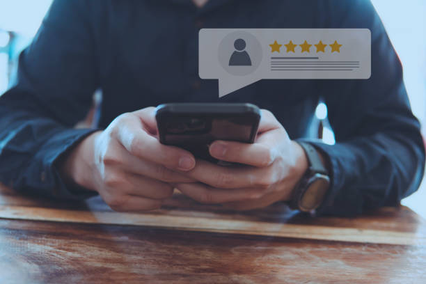 istock Customer review good rating concept and hand pressing smile face icon and five star on visual screen for quality and positive customer feedback, testimonial and testimony. 1436752761