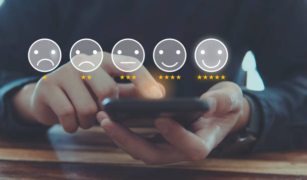 istock Customer review good rating concept and hand pressing smile face icon and five star on visual screen for quality and positive customer feedback, testimonial and testimony. 1436752779