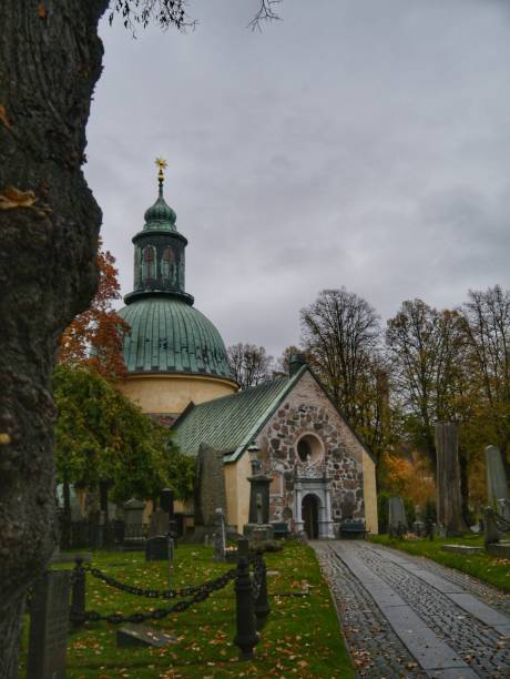 istock Old stone church against sky during autumn 1436752780