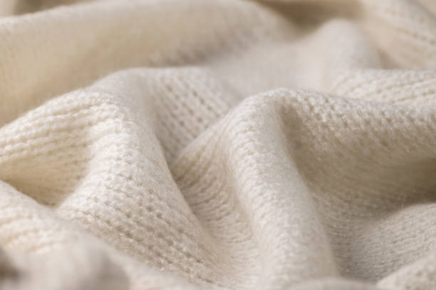 istock Fashionable knitted woolen cloth, warm soft textile close up view 1436753745