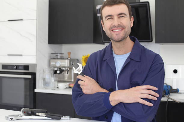 istock Repairman holding tool in the kitchen 1436754670