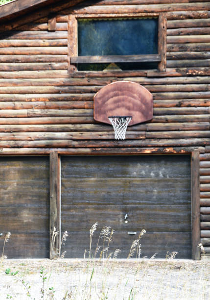 istock Basketball Hoop on Log Cabin 1436754723
