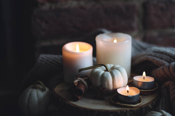 istock Autumn home composition with aromatic candle, dry citrus, cinnamon, anise. Aromatherapy on a grey fall morning, atmosphere of cosiness and relax. Wooden background close up 1436756898