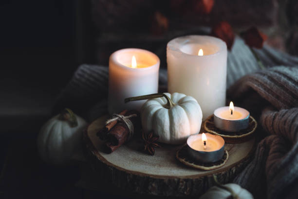 istock Autumn home composition with aromatic candle, dry citrus, cinnamon, anise. Aromatherapy on a grey fall morning, atmosphere of cosiness and relax. Wooden background close up 1436756899