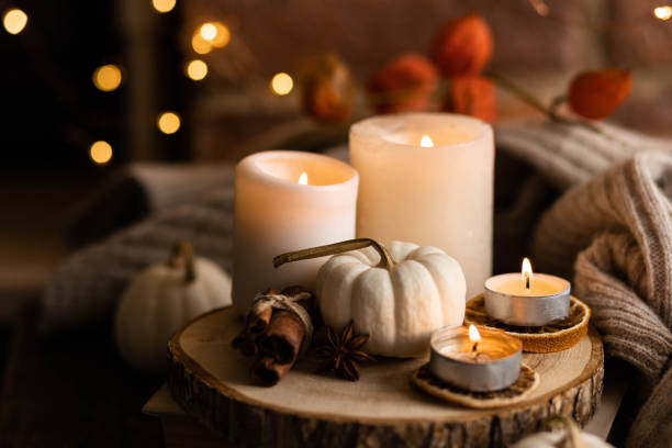 istock Autumn home composition with aromatic candle, dry citrus, cinnamon, anise. Aromatherapy on a grey fall morning, atmosphere of cosiness and relax. Wooden background close up 1436756918