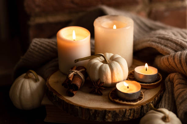 istock Autumn home composition with aromatic candle, dry citrus, cinnamon, anise. Aromatherapy on a grey fall morning, atmosphere of cosiness and relax. Wooden background close up 1436756926