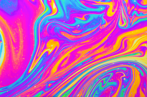 Psychedelic multicolored background abstract. Rainbow colors. patterns background. Photo macro shot of soap bubbles