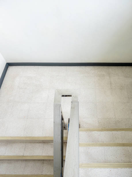 istock The empty dog-leg staircase with the metal handrail. 1436760981